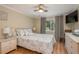 Comfortable bedroom featuring a queen bed and a window providing natural light at 8240 144Th Ln, Seminole, FL 33776