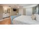 Bright bedroom with a ceiling fan, closet, and an ensuite bathroom at 8240 144Th Ln, Seminole, FL 33776