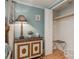 Bedroom showing wooden furniture, light blue walls, and an open closet at 8240 144Th Ln, Seminole, FL 33776