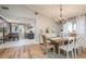 Bright dining area features a chandelier and access to another dining space at 8240 144Th Ln, Seminole, FL 33776