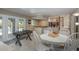 Recreational room has a game table and access to the outdoor living area at 8240 144Th Ln, Seminole, FL 33776