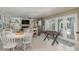 Recreational room features a game table, fireplace, and access to an outdoor pool at 8240 144Th Ln, Seminole, FL 33776