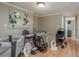 Spacious room filled with baby gear and toys, showcasing its potential as a playroom or Bedroom at 8240 144Th Ln, Seminole, FL 33776