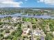 Aerial view showcasing the property's location, nearby lake, and surrounding neighborhood at 9917 Prevatt St, Gibsonton, FL 33534