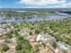 Aerial view of property, surrounded by lush greenery, and close to a beautiful river at 9917 Prevatt St, Gibsonton, FL 33534