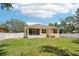 Spacious backyard with a screened in lanai and privacy fence at 9917 Prevatt St, Gibsonton, FL 33534