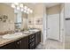 Bathroom features a double sink vanity, granite countertops, and recessed lighting at 9917 Prevatt St, Gibsonton, FL 33534