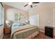 Cozy bedroom with a closet, lamps, and decorative accents at 9917 Prevatt St, Gibsonton, FL 33534