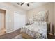 Comfortable bedroom with closet, accent art, and neutral tones at 9917 Prevatt St, Gibsonton, FL 33534