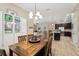 Open floor plan from dining room to kitchen and living room at 9917 Prevatt St, Gibsonton, FL 33534
