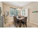 Bright dining room features a large window and built-in storage cabinets with seating for six at 9917 Prevatt St, Gibsonton, FL 33534