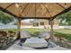 Cozy gazebo with cushioned seating area, perfect for relaxing or entertaining at 9917 Prevatt St, Gibsonton, FL 33534