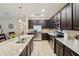 Spacious kitchen features granite countertops, stainless steel appliances, and ample cabinet space at 9917 Prevatt St, Gibsonton, FL 33534