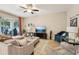 Inviting living room featuring comfortable seating, stylish decor, and access to the screened-in patio at 9917 Prevatt St, Gibsonton, FL 33534