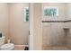 Tiled shower featuring a window and built in niche at 9917 Prevatt St, Gibsonton, FL 33534