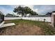 Well-maintained backyard with a white fence, offering ample space for outdoor enjoyment and gardening at 10051 82Nd Ln, Seminole, FL 33777