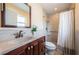 Beautifully renovated bathroom featuring a modern vanity, granite countertop and tiled walk-in shower at 10051 82Nd Ln, Seminole, FL 33777