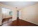 Inviting bedroom with wood-look floors, a mirrored closet, and neutral walls, providing a comfortable and stylish space at 10051 82Nd Ln, Seminole, FL 33777