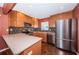 Modern kitchen features stainless steel appliances, custom backsplash, stylish cabinets and center island at 10051 82Nd Ln, Seminole, FL 33777