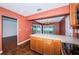 Modern kitchen features a center island, stylish cabinets, generous countertop space and convenient access to the dining room at 10051 82Nd Ln, Seminole, FL 33777