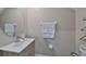 Clean half bathroom features a vessel sink, brushed nickel faucet and modern gray paint at 10202 White Linen Ave, Riverview, FL 33578