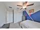 Bright bedroom with basketball hoop, ceiling fan, and closet at 10202 White Linen Ave, Riverview, FL 33578
