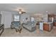 Comfortable living room open to kitchen and dining, featuring stylish decor and neutral tones at 10202 White Linen Ave, Riverview, FL 33578