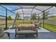 Relaxing screened patio with basketball hoop and outdoor seating at 10202 White Linen Ave, Riverview, FL 33578