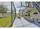 The screened patio has an outdoor table, seating, and basketball hoop at 10202 White Linen Ave, Riverview, FL 33578