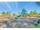 Community playground featuring slides and a swing set surrounded by mulch at 10202 White Linen Ave, Riverview, FL 33578