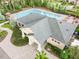 An aerial shot shows a community pool surrounded by lounge chairs and a well-maintained clubhouse at 10202 White Linen Ave, Riverview, FL 33578