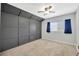 Modern bedroom with neutral walls and carpet and a decorative headboard wall at 10819 Newbridge Dr, Riverview, FL 33579