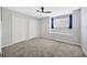 Bedroom featuring neutral walls, two closets and an abundance of natural light at 10819 Newbridge Dr, Riverview, FL 33579
