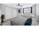 Bedroom featuring neutral walls, two closets and an abundance of natural light at 10819 Newbridge Dr, Riverview, FL 33579