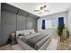 Modern bedroom with neutral walls and carpet and a decorative headboard wall at 10819 Newbridge Dr, Riverview, FL 33579