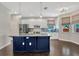 Contemporary kitchen featuring a center island, sleek appliances, and an open layout at 10819 Newbridge Dr, Riverview, FL 33579