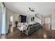 Cozy living room featuring hardwood floors, recessed lighting, and a modern entertainment center at 10819 Newbridge Dr, Riverview, FL 33579