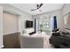 Cozy living room with a large window, stylish furniture, and a ceiling fan at 10819 Newbridge Dr, Riverview, FL 33579