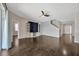 Bright living room featuring hardwood floors, recessed lighting, and an entertainment center at 10819 Newbridge Dr, Riverview, FL 33579