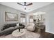 Inviting living room flows into dining area, complete with modern furnishings and hardwood floors at 10819 Newbridge Dr, Riverview, FL 33579