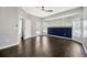 Bright main bedroom with hardwood floors, natural lighting, and an accent wall at 10819 Newbridge Dr, Riverview, FL 33579
