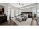Beautiful main bedroom featuring hardwood floors, natural lighting, and modern decor at 10819 Newbridge Dr, Riverview, FL 33579