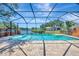 Screened in pool and hot tub area with a lake view at 10819 Newbridge Dr, Riverview, FL 33579