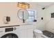 Updated bathroom featuring sleek fixtures, a modern vanity, and a tiled shower at 1145 53Rd N Ave, St Petersburg, FL 33703
