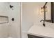 The renovated bathroom features a glass enclosed shower with marble tile and a stylish showerhead at 1145 53Rd N Ave, St Petersburg, FL 33703