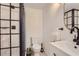 This bathroom features a white vanity, a round mirror, and a walk-in shower at 1145 53Rd N Ave, St Petersburg, FL 33703
