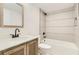 Modern bathroom featuring a shower-tub combo with decorative tile and a stylish vanity with ample counter space at 1145 53Rd N Ave, St Petersburg, FL 33703