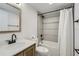 Well-lit bathroom with a tub and shower combo plus modern vanity and fixtures at 1145 53Rd N Ave, St Petersburg, FL 33703