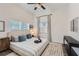 Cozy bedroom featuring a queen bed, two windows allowing natural light, and stylish decorations at 1145 53Rd N Ave, St Petersburg, FL 33703