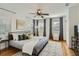 This bedroom features a ceiling fan, wooden floors, and plenty of natural light at 1145 53Rd N Ave, St Petersburg, FL 33703